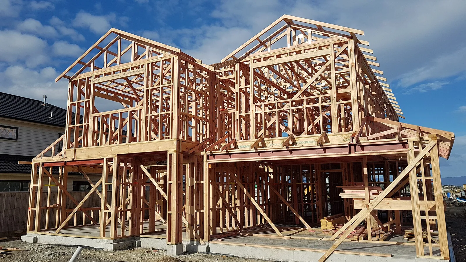 Timber wall and roof framing for a new house.