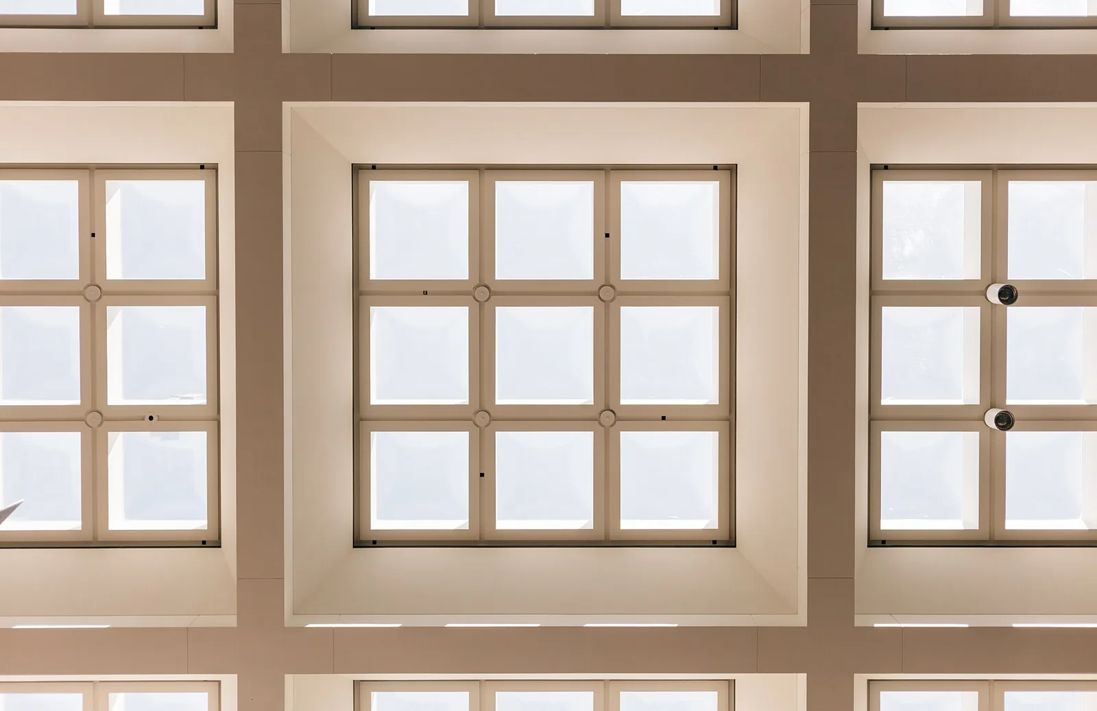 Tall windows and pale painted wall details.