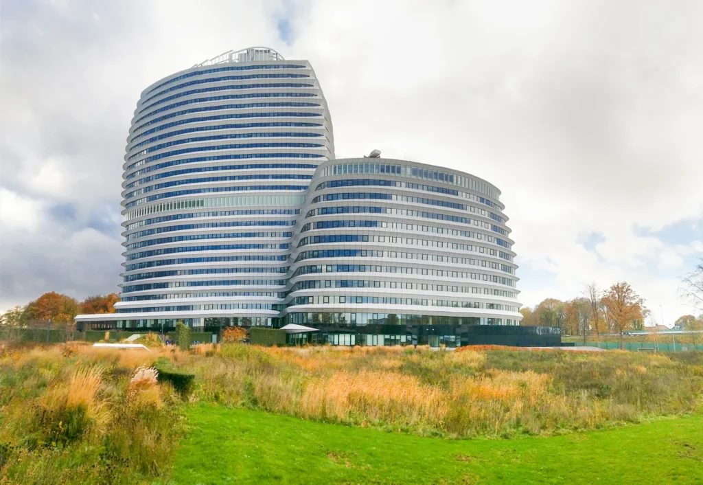 Curved white DUO office towers in Groningen.